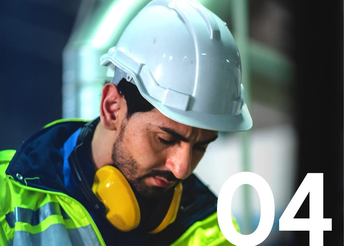 Male engineer wearing hard hat and safety gear.